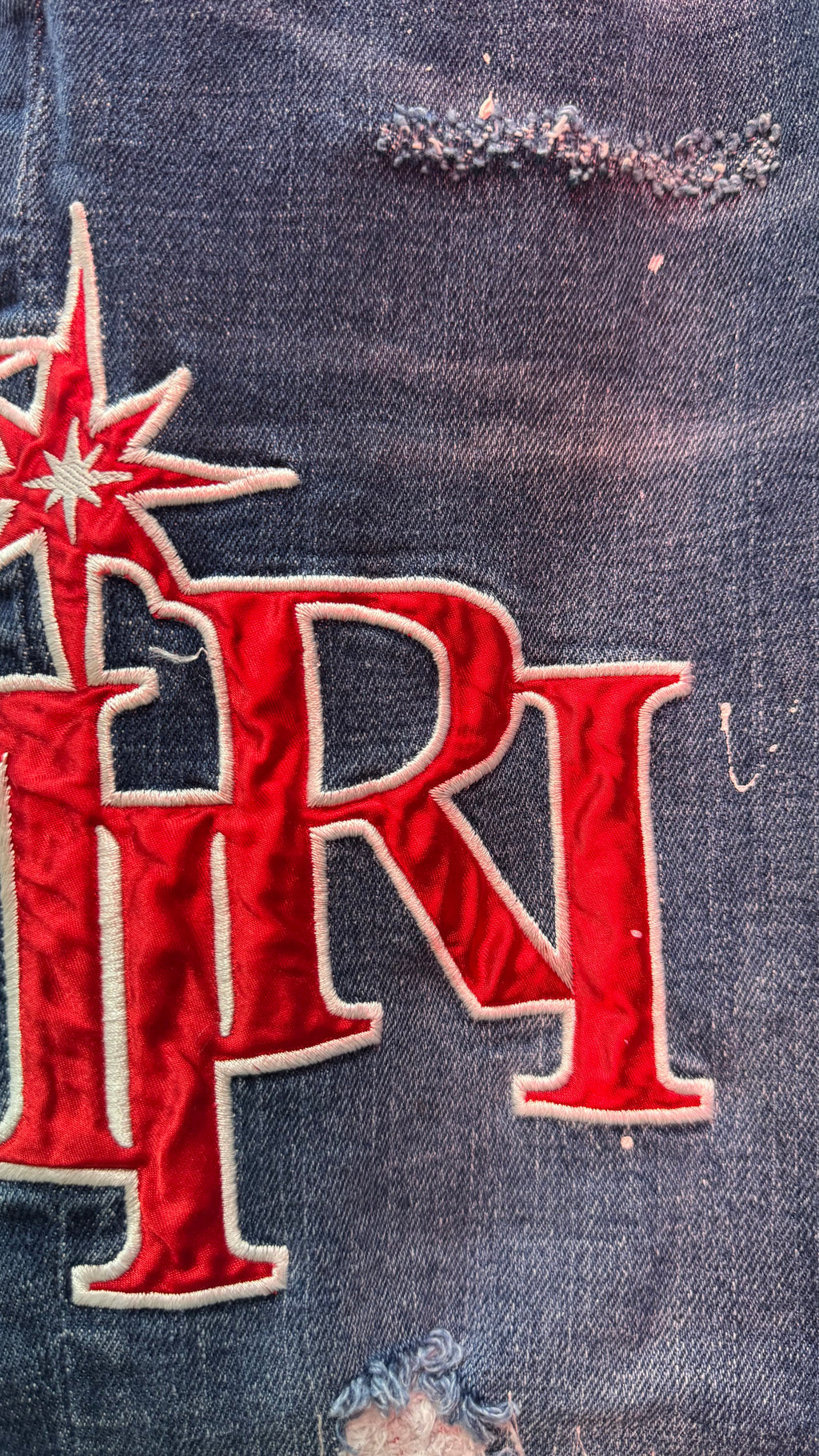 AMIRI Patch Distressed Jean
