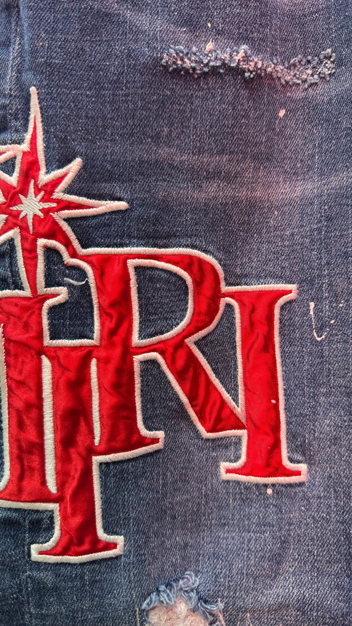 AMIRI Patch Distressed Jean